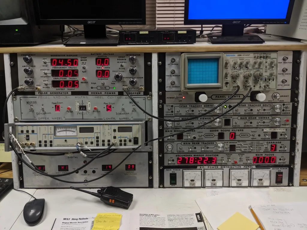 A control panel with many buttons, knobs, sliders, and switches.